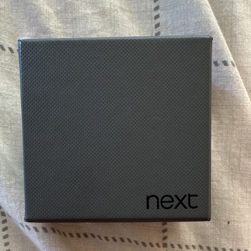 Next cufflink and tie - and,